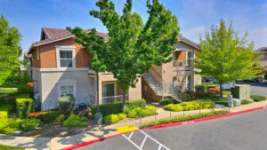 Exterior Aerial, Residential building, meticulous landscaping, lush vegetation, two story walk-up.